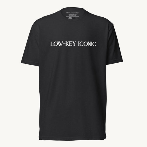 Black unisex fitted T‑shirt with minimalist ‘Low Key Iconic’ design.