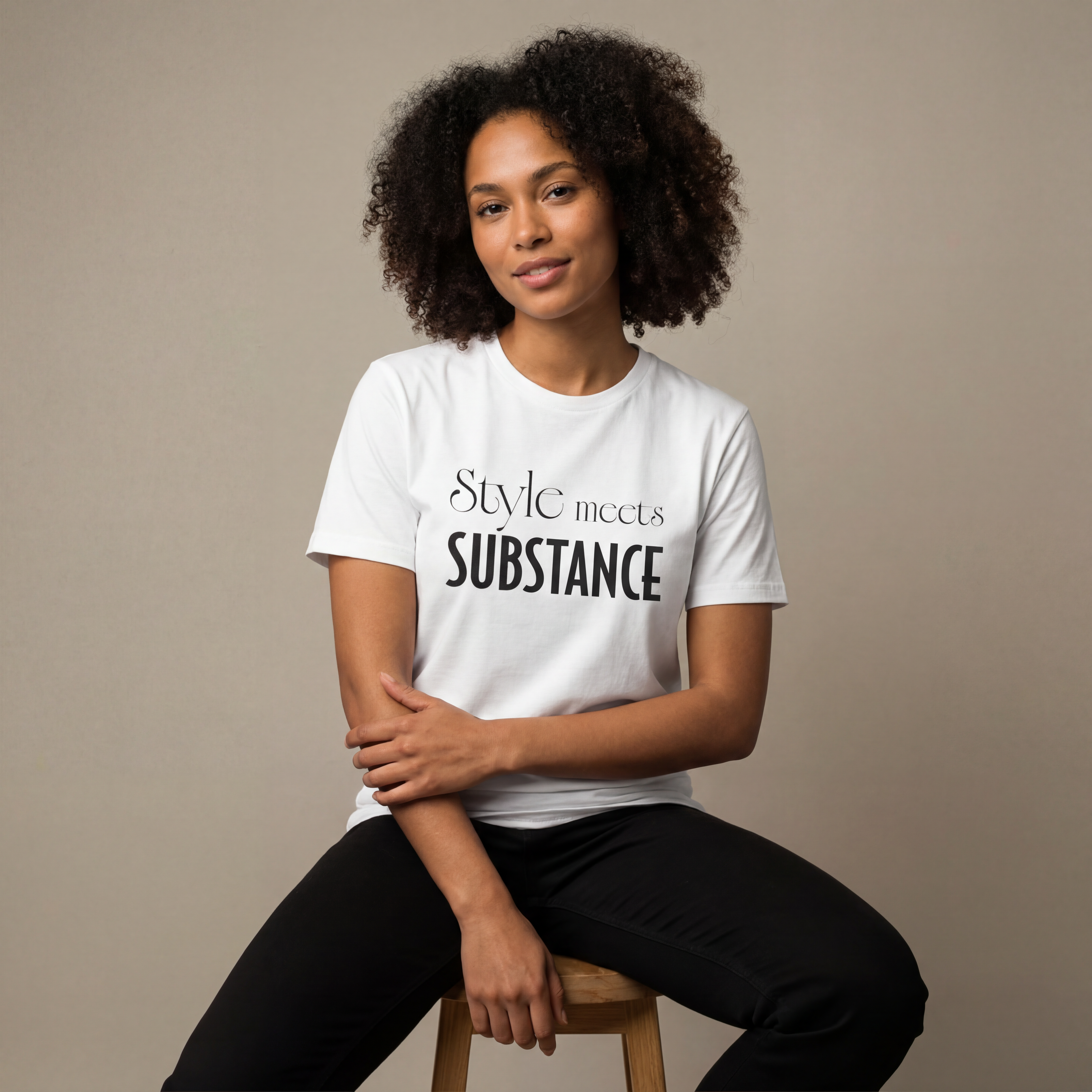 Woman wearing the "style meets substance" minimalist graphic tee in a soft neutral studio setting, calm and welcoming.