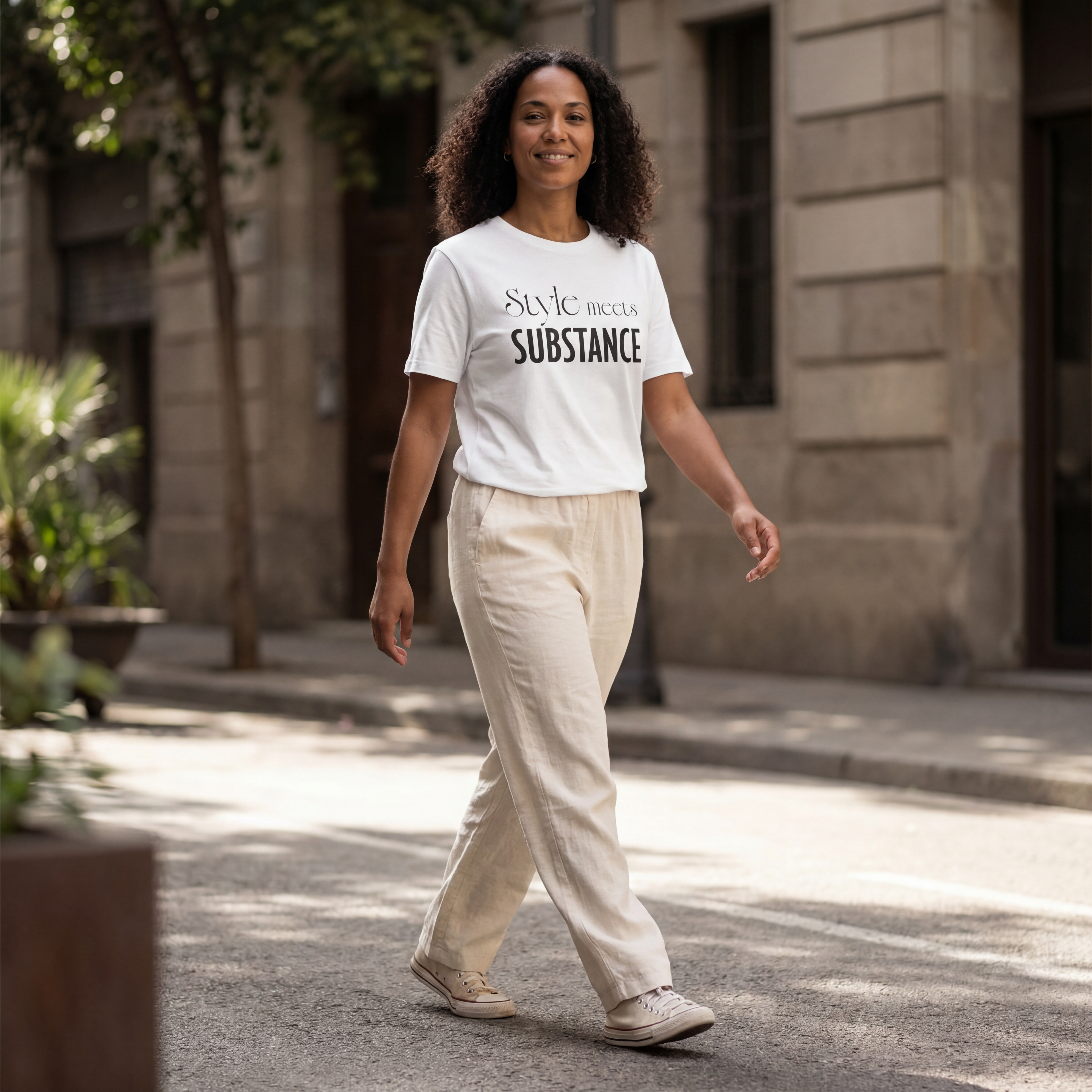 Woman wearing the "style meets substance" minimalist graphic tee with gentle movement and a warm, approachable expression.
