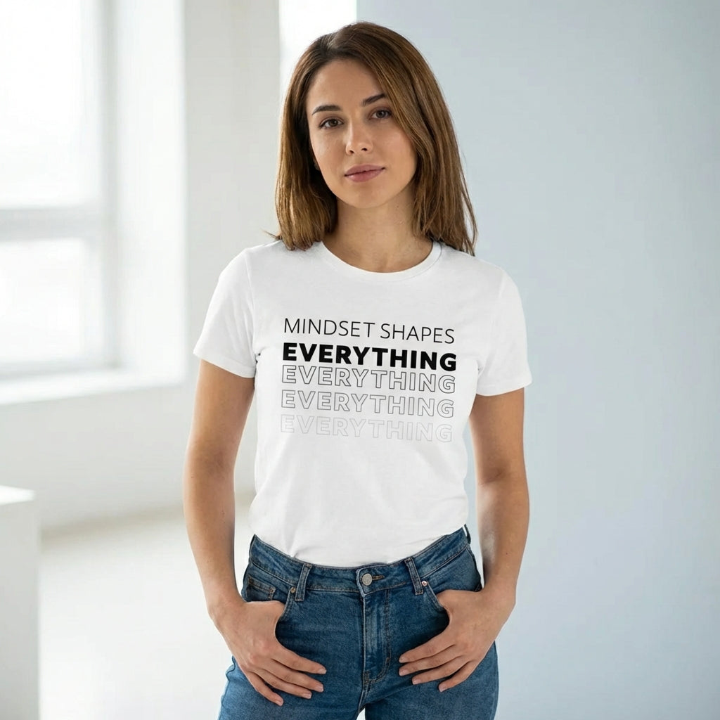 Woman wearing the "mindset shapes everything" motivational tshirt in warm natural sunlight with a peaceful, reflective mood.