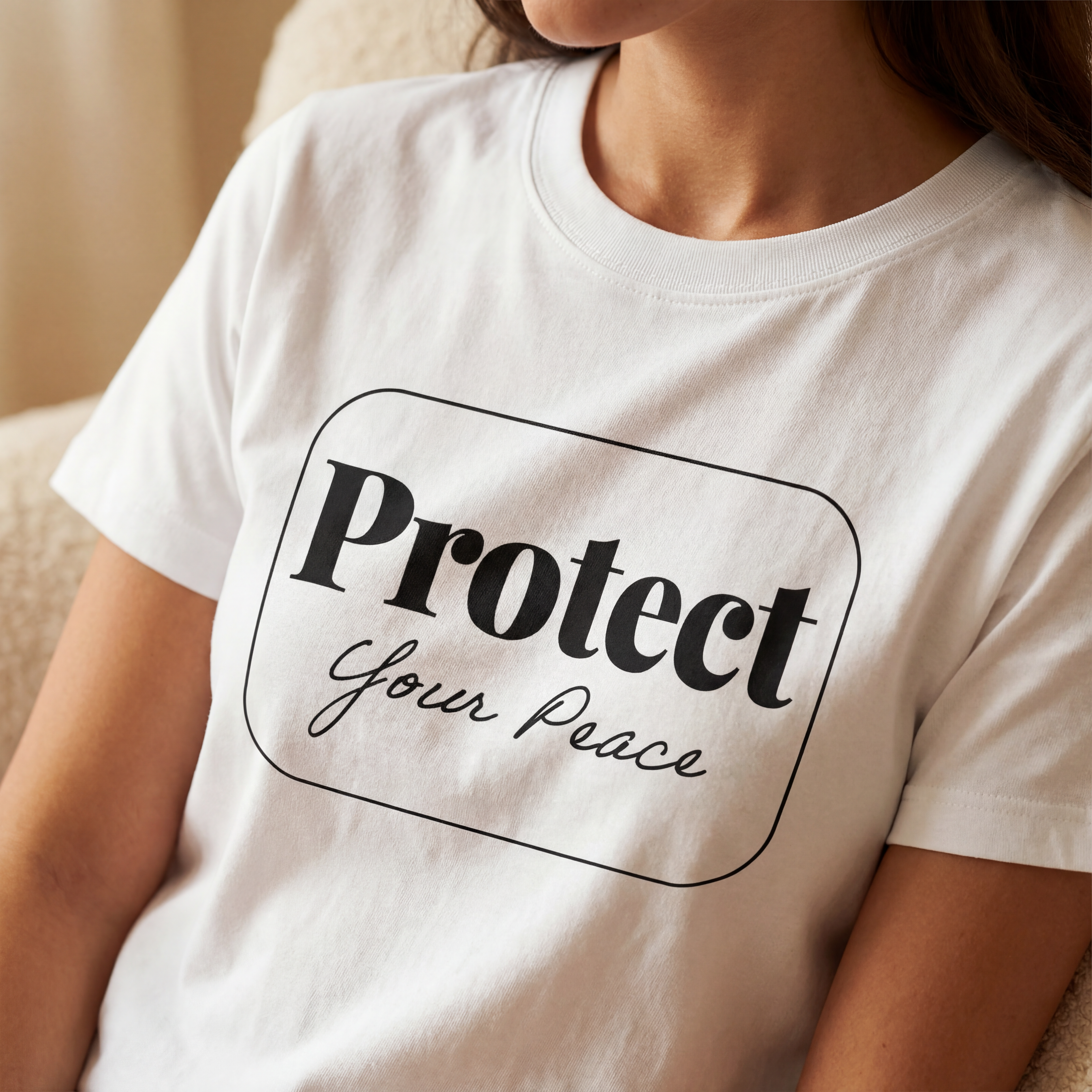 Close up of the Protect your peace organic cotton t shirt showing soft fabric texture and clean printed text.